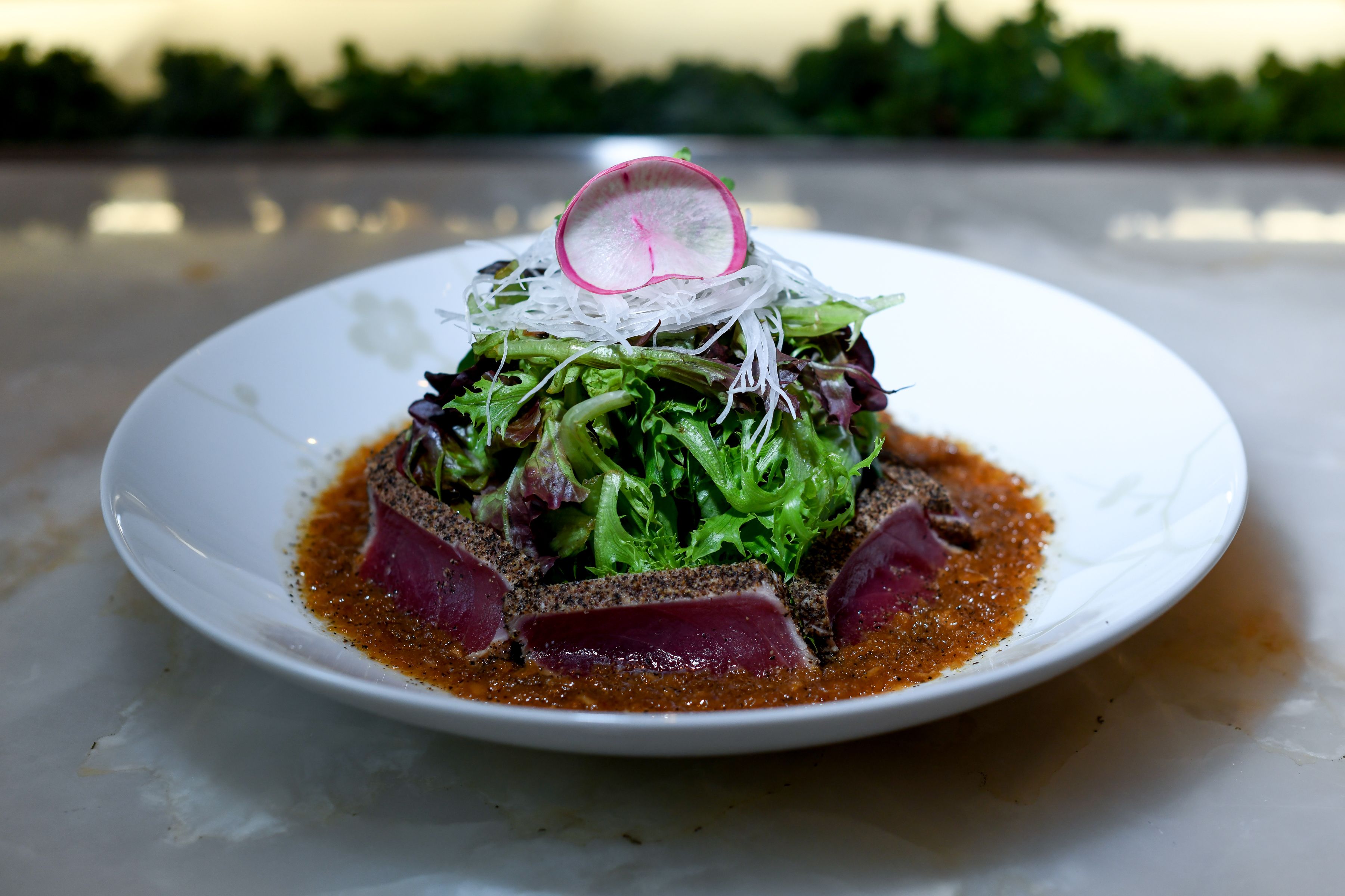 NOBU-STYLE SASHIMI SALAD: Seared Ahi Tuna and field greens tossed with Matsuhisa dressing